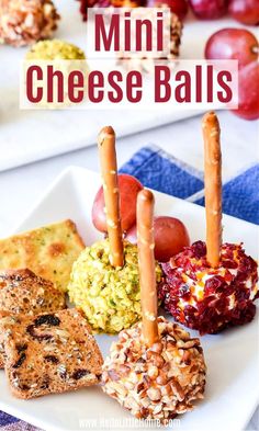 mini cheese balls on a white plate with crackers and grapes in the background text overlay reads mini cheese balls