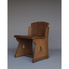 a wooden chair sitting on top of a table