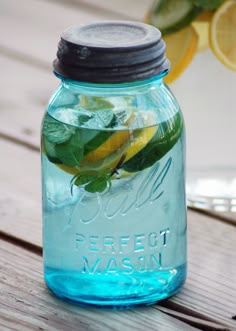 a mason jar filled with water and lemon slices