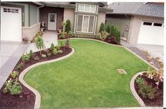 a large yard with green grass and landscaping