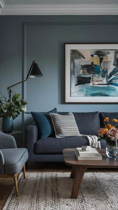 a living room with blue walls and furniture