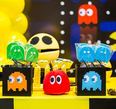 pacman party favors and decorations on a table