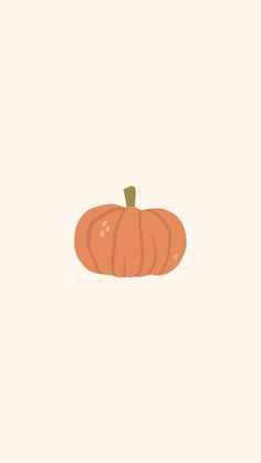 an orange pumpkin sitting on top of a white surface