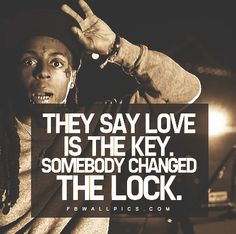 a man with dreadlocks and a sign that says, they say love is the key somebody changed the lock