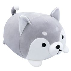 a gray and white stuffed animal head on a white background with black dots around the eyes