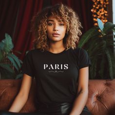 Paris France Bella and Canva T-shirt. About our tees: This classic unisex jersey short sleeve tee fits like a well-loved favorite. Soft cotton and quality print make users fall in love with it over and over again. These t-shirts have-ribbed knit collars to bolster shaping. The shoulders have taping for better fit over time. Dual side seams hold the garment's shape for longer.  Sizing Chart: Use the sizing chart to understand the measurement of our T-Shirts. For the oversized look, please size up. Return policy:  We do not accept returns unless items are damaged. This is due to our shirts being custom made-to-order. Paris Tshirt, Vacation In Paris, Travel To France, Paris Gifts, Travel Tees, Paris T Shirt, Europe Trip, Travel Lover, Paris Travel