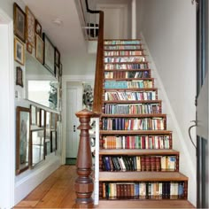 there is a stair case with many books on it