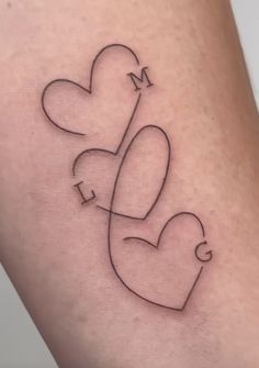 a couple of hearts that are connected to each other with the word love on it