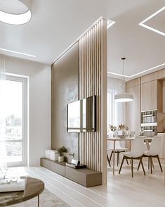 a living room filled with furniture and a flat screen tv on top of a wall