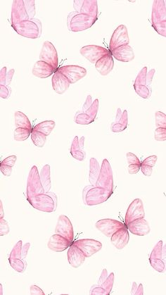 pink butterflies are flying in the air on a white background with watercolor paint effect