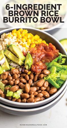 a bowl filled with beans, avocado and other vegetables