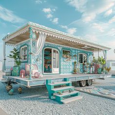 a small blue and white house sitting on the back of a flatbed trailer with steps leading up to it