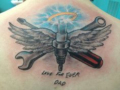 the back of a man's shoulder with wrenches and wings on it that says live for ever dad