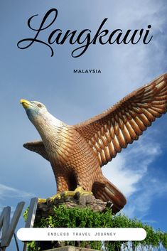 an eagle statue with the words langkawi on it's front and side