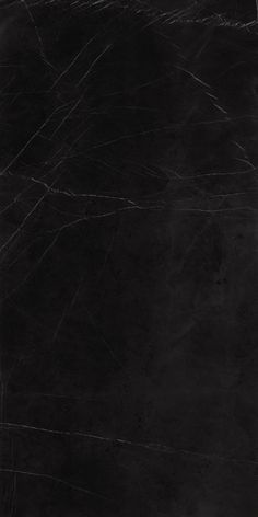 black marble textured paper with scratches on the edges and bottom edge, as well as some lines in the middle