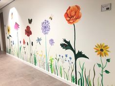 an office hallway painted with flowers and butterflies