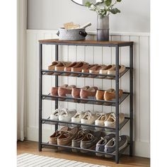 the shoe rack is holding several pairs of shoes