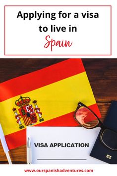 the spanish visa application is being displayed on a desk with a passport, eyeglasses and