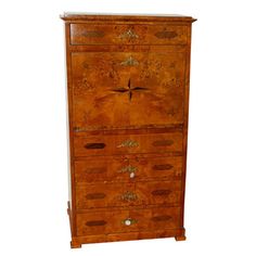 an old wooden cabinet with many drawers