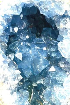 a bunch of blue glass pieces sitting on top of a table