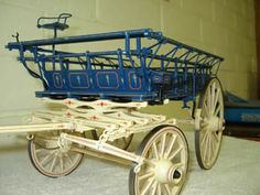 a blue and white cart sitting on top of a floor