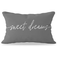 a gray pillow with the words sweet dreams written in cursive writing on it