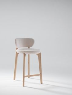 a white stool with a wooden frame and seat