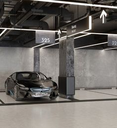 an electric car is parked in a parking garage with arrows pointing to the left and right