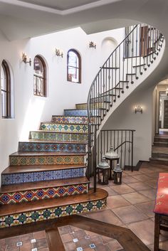 the stairs are decorated with colorful tiles