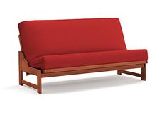 a red futon sofa bed sitting on top of a white floor next to a wooden frame