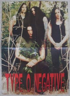 the band type o negative are standing behind barbed wire