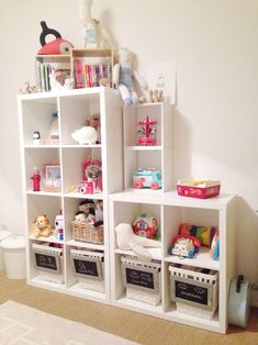 a white shelf filled with lots of toys