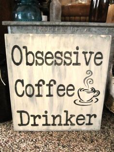 a sign that says obsesive coffee drinker on the side of a counter