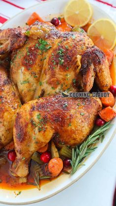 roasted chicken with carrots and cranberries in a white bowl on a table