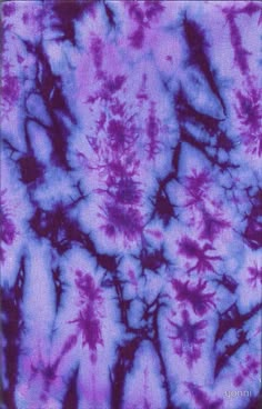 an abstract tie - dyed background in purple and blue