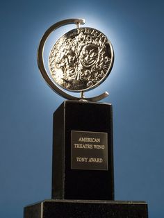 the american theatre wing's tony award is shown in front of a blue sky