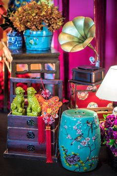 an assortment of colorful vases and other decorative items