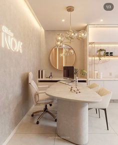 a white dining room with a round table and chairs