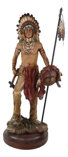 a statue of a native american man holding a fish