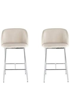 two white chairs sitting next to each other