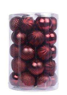 a clear container filled with shiny red christmas bauble ornament balls on a white background