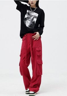 Radiate bold vibes with these red, wide-leg cargo pants. Made from soft cotton, they're designed with a drawstring belt for an adjustable fit. With a zip and button fastening, they feature extra pockets for added utility. A daring and trendy choice for those wanting to make a statement. Zip & button fastening Drawstring belt Cotton Extra pockets Wide leg Y2k Outfits Aesthetic, Jeans Patchwork, Fall Sweaters For Women, Aesthetic Clothing Stores, Denim Hoodie, Jogger Pants Casual, Corset Bustier, Bubble Skirt, Cargo Skirt