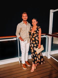 a man and woman standing next to each other on a deck