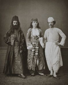 three people standing next to each other posing for a photo in an old fashioned photo