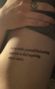 someone with a tattoo on their thigh that says, don't make yourself feel nothing wrong