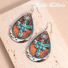 Rustic Couture's Western Cross Teardrop Dangling Earring Material：Silver-tone metal and turquoise stones Size：3.2″（H）×1.6″(W) Western Cross, Western Earrings, Turquoise Stones, Jewelry Diy, Contrast Stitch, Turquoise Stone, Sugar Skull, Silver Tone, Dangle Earrings