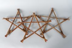 several wooden sticks arranged in the shape of a star