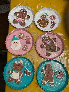 paper plates decorated with gingerbread cookies and other decorations