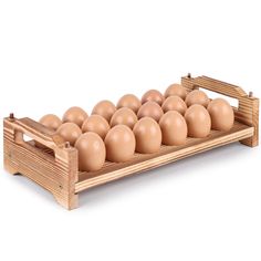 a wooden crate filled with brown eggs