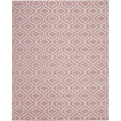 a pink and white rug with circles on it